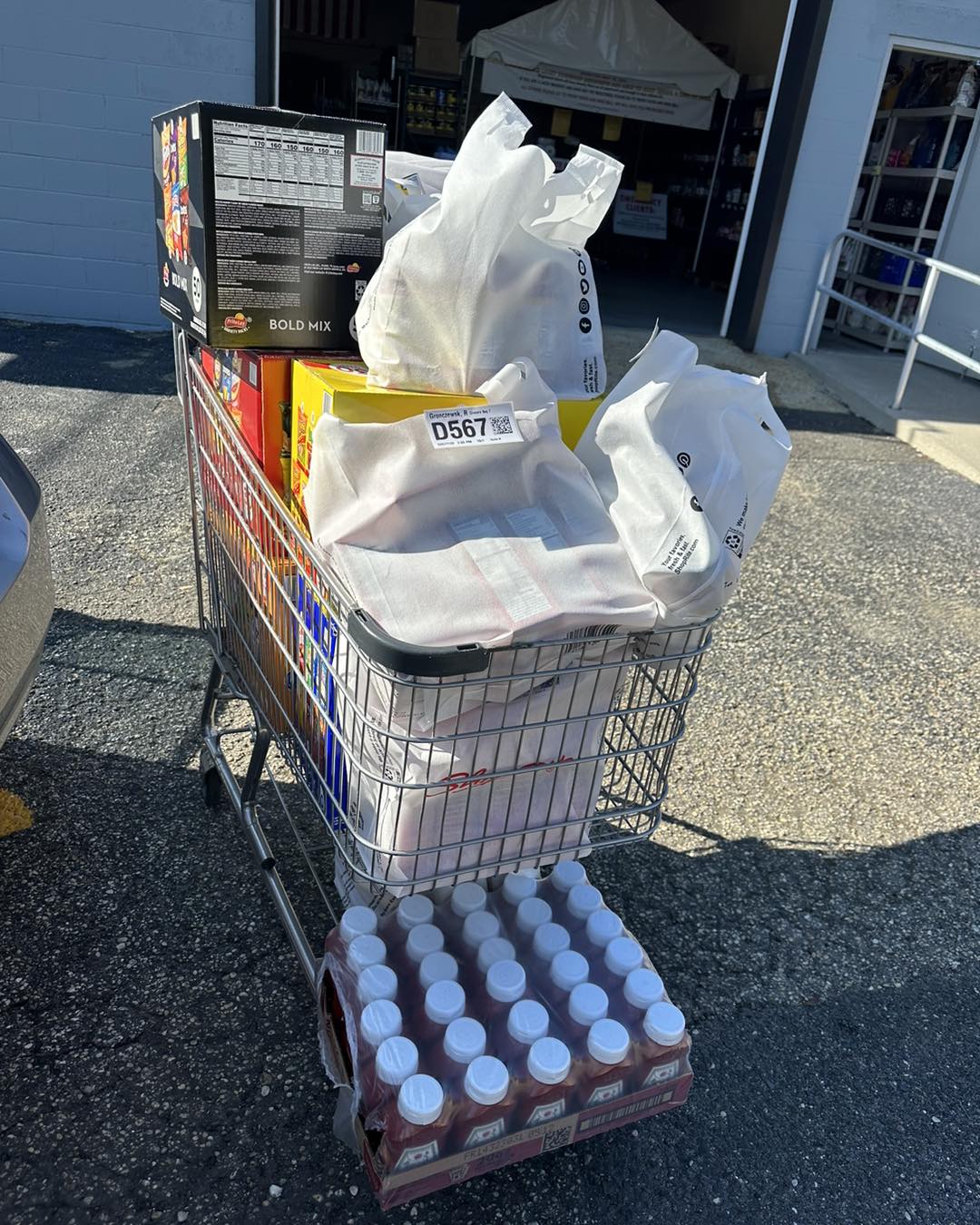 overflowing shopping cart with food