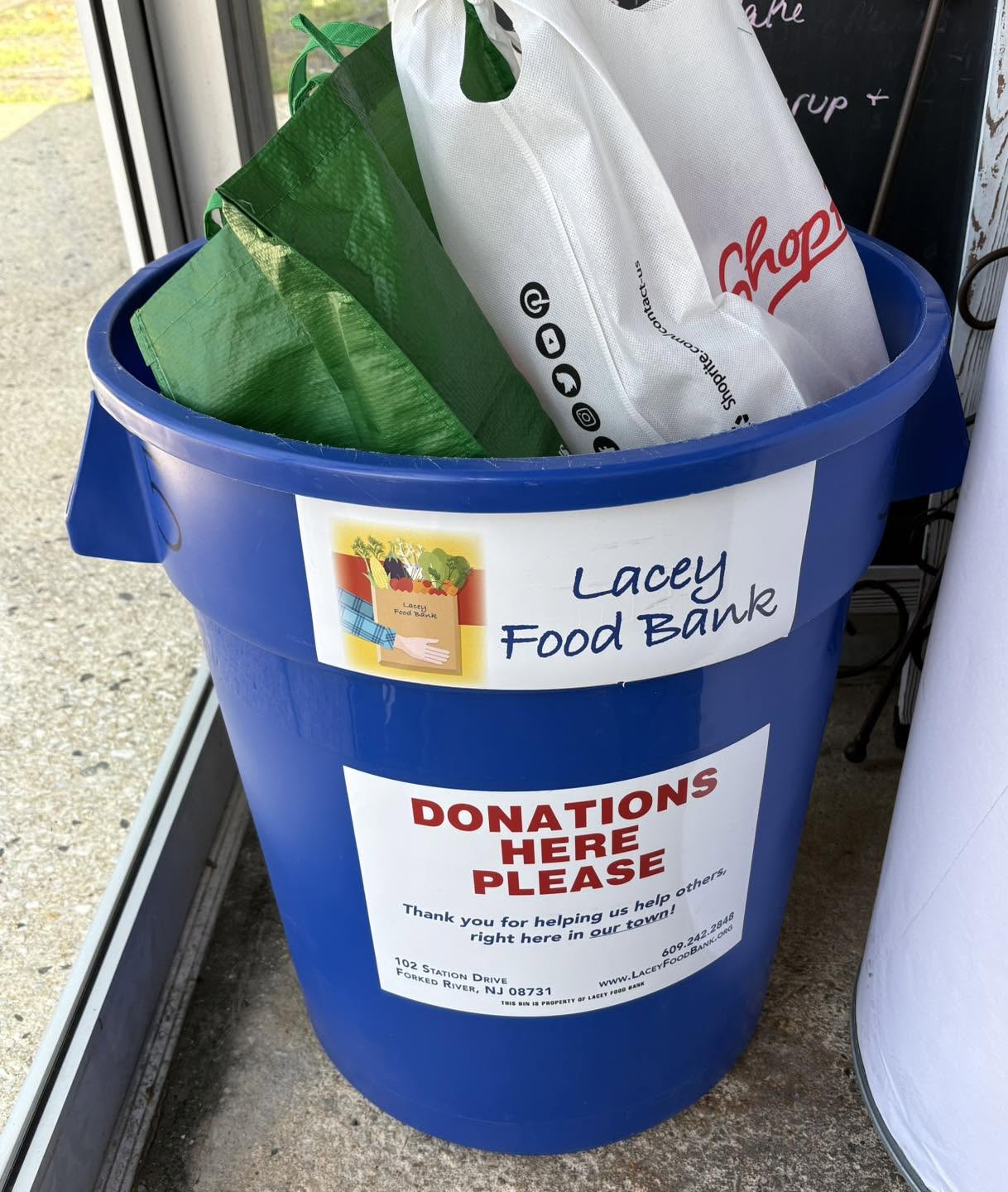 Lacey Diner Blue bin with food donations in it
