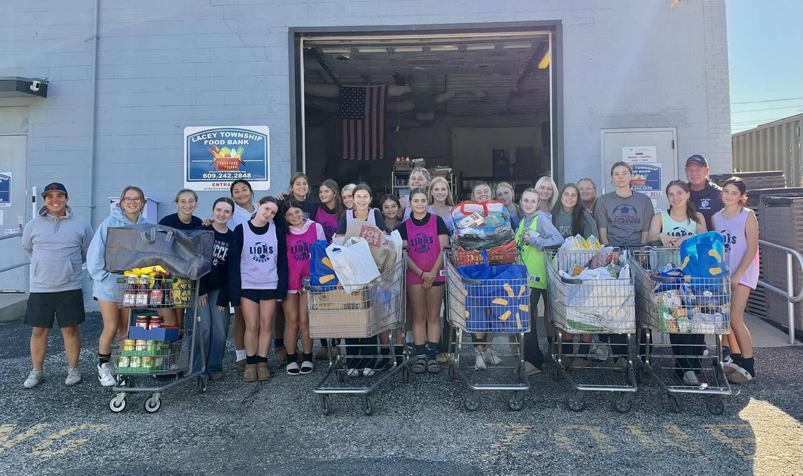 Lacey Girls soccer team dropping off donations at the food bank